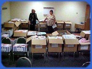 Vicki and Danette amidst many boxes